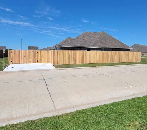 New cedar privacy fence installation