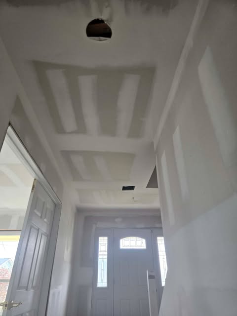 Entryway drywall finishing with coffered ceiling